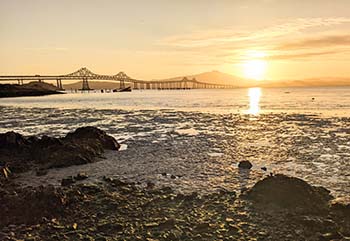 Sun setting over the Bay behind Mt. Tamalpais and the Richmond Bridge